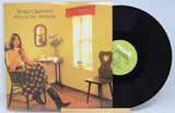 Front cover of Nanci Griffith's 'Poet in My Window' vinyl LP showing Nanci seated by a sunlit window with a vase of roses