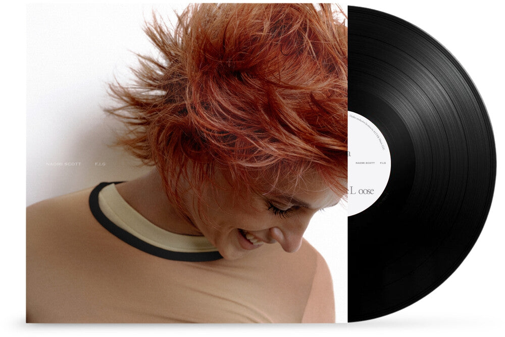 Vinyl record with a person with red hair on the cover