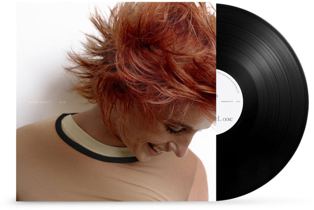 Vinyl record with a person with red hair on the cover