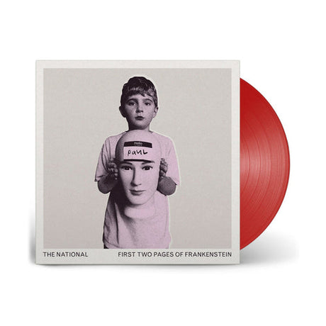 Album cover art for The National's First Two Pages of Frankenstein featuring a black and white photograph of a person holding a sign with the name 'Paul'.