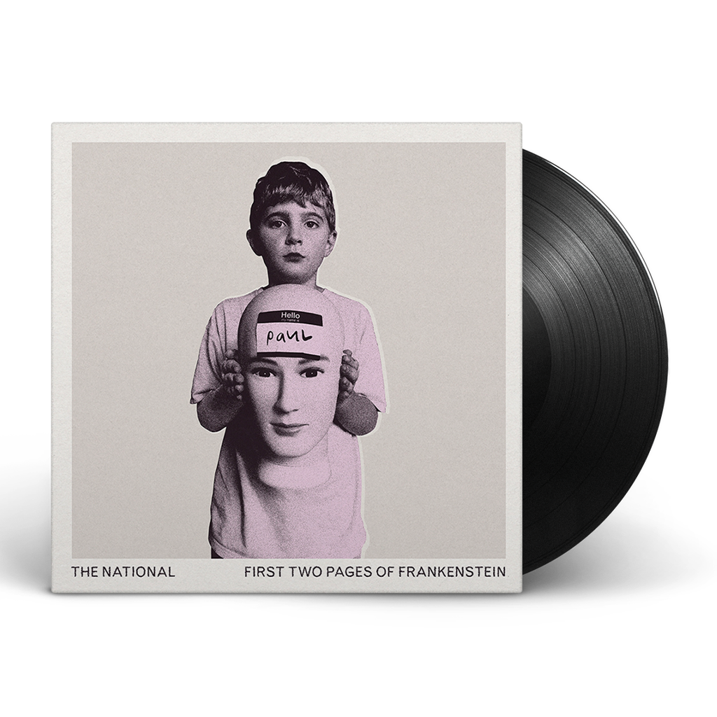 Album cover art for The National's First Two Pages of Frankenstein featuring a black and white photograph of a person holding a sign with the name 'Paul'.