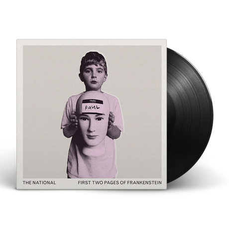 Album cover art for The National's First Two Pages of Frankenstein featuring a black and white photograph of a person holding a sign with the name 'Paul'.