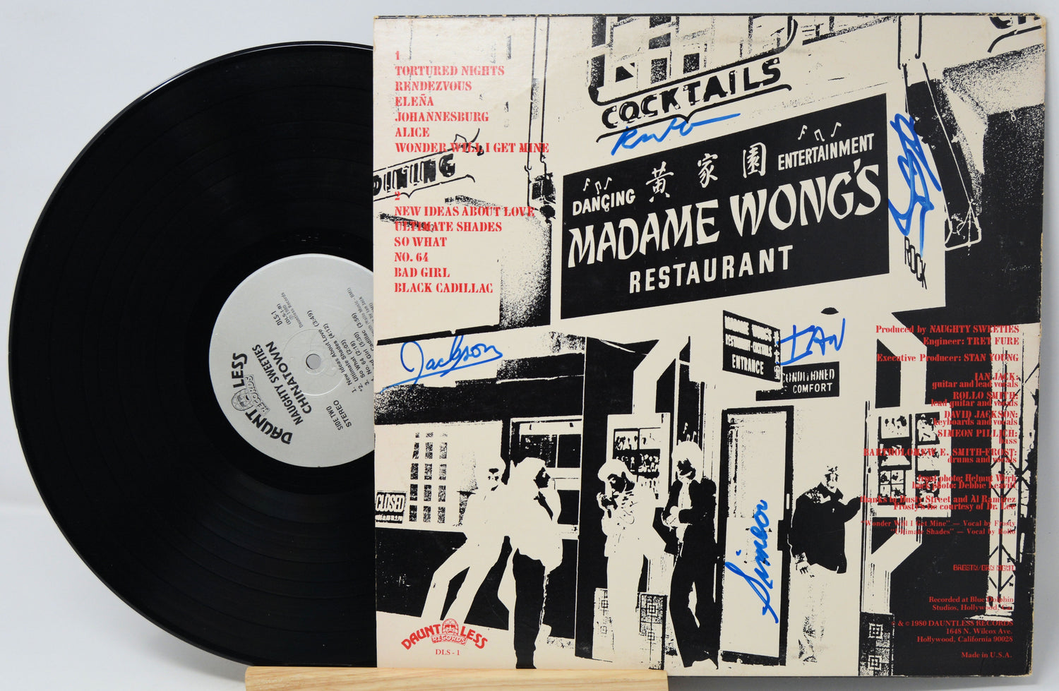 Vinyl record with a cover featuring black and white graphics and text, including 'Madame Wong's Restaurant'.