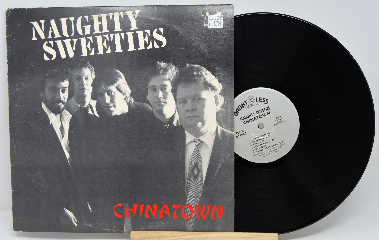 Vinyl record with cover titled 'Naughty Sweeties Chinatown' on a white background