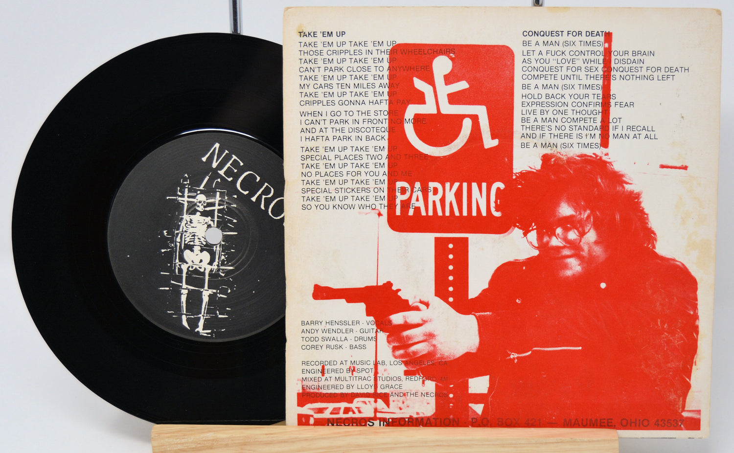 Vinyl record with cover featuring a graphic design and text