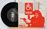 Vinyl record with cover featuring a graphic design and text