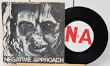 Vinyl record with 'Negative Approach' album cover featuring a black and white image of a face.