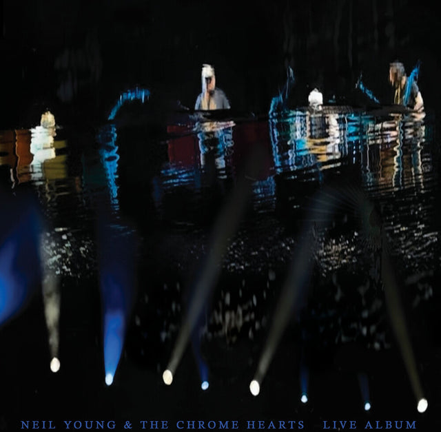 Stage with spotlights and a reflective water surface, featuring 'Neil Young & The Chrome Hearts Live Album'.