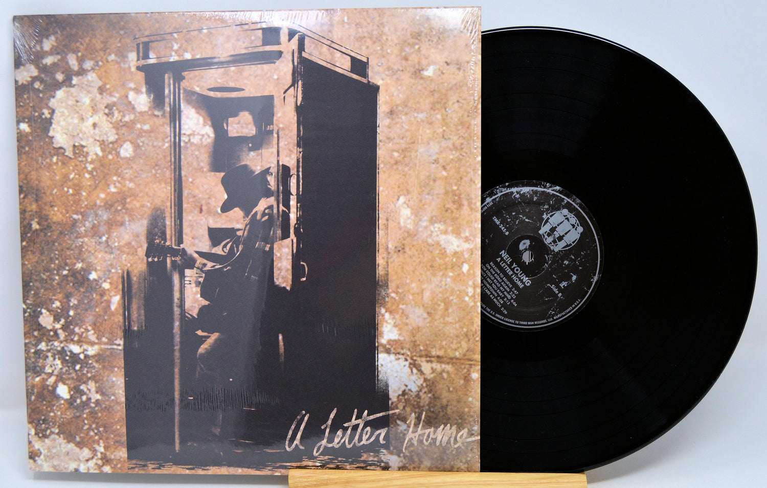 Front cover of Neil Young's 'A Letter Home' vinyl LP featuring silhouette in phone booth