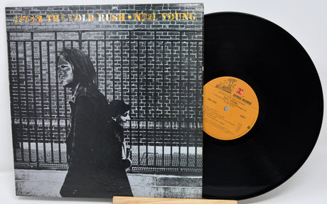 Vinyl record with cover featuring a person and text, on a white background