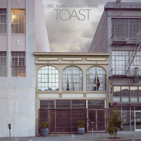Album cover of 'Toast' by Neil Young with Crazy Horse featuring a building facade.