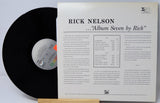 Vinyl record with its cover displaying 'Rick Nelson Album Seven by Rick' on a light gray background.