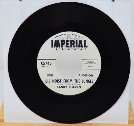 Vinyl record with 'Imperial' label and text on a white background