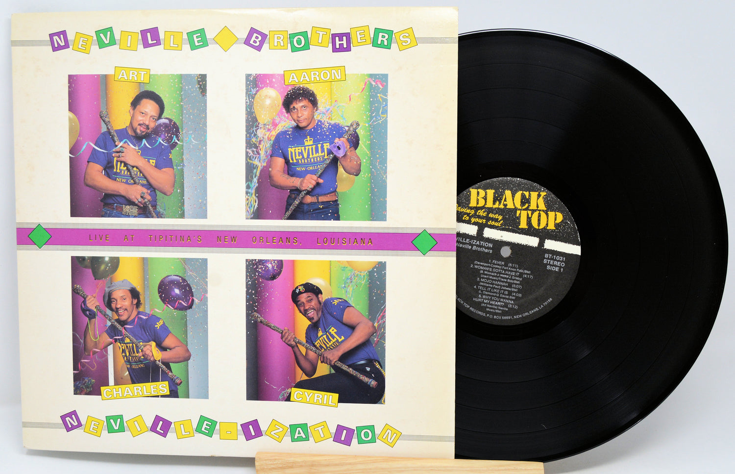 Vinyl record with colorful cover featuring four images of a person and 'Black Top' label.