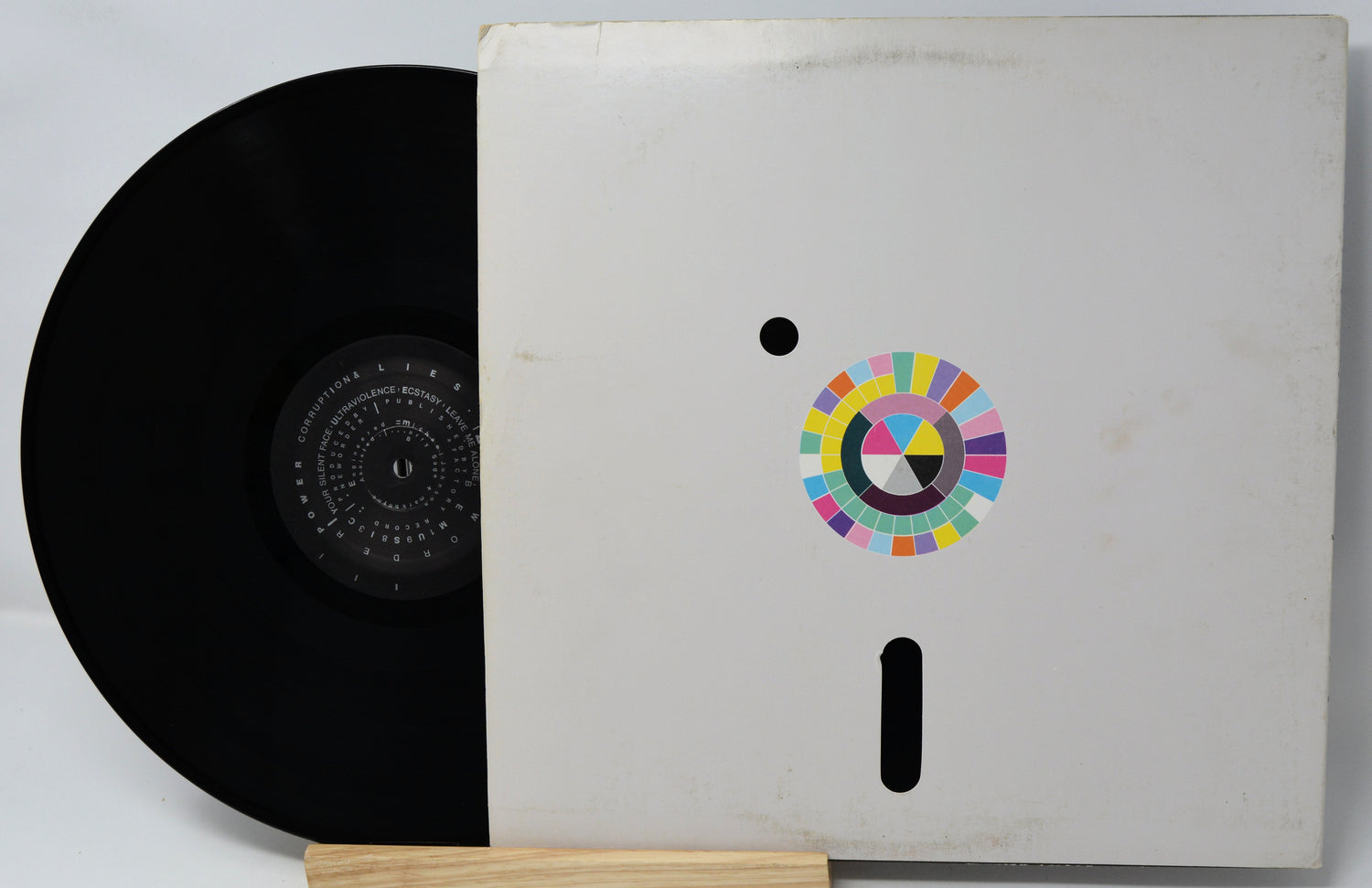 Vinyl record with a colorful logo on its cover