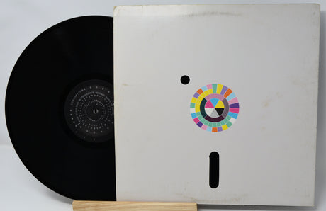 Vinyl record with a colorful logo on its cover