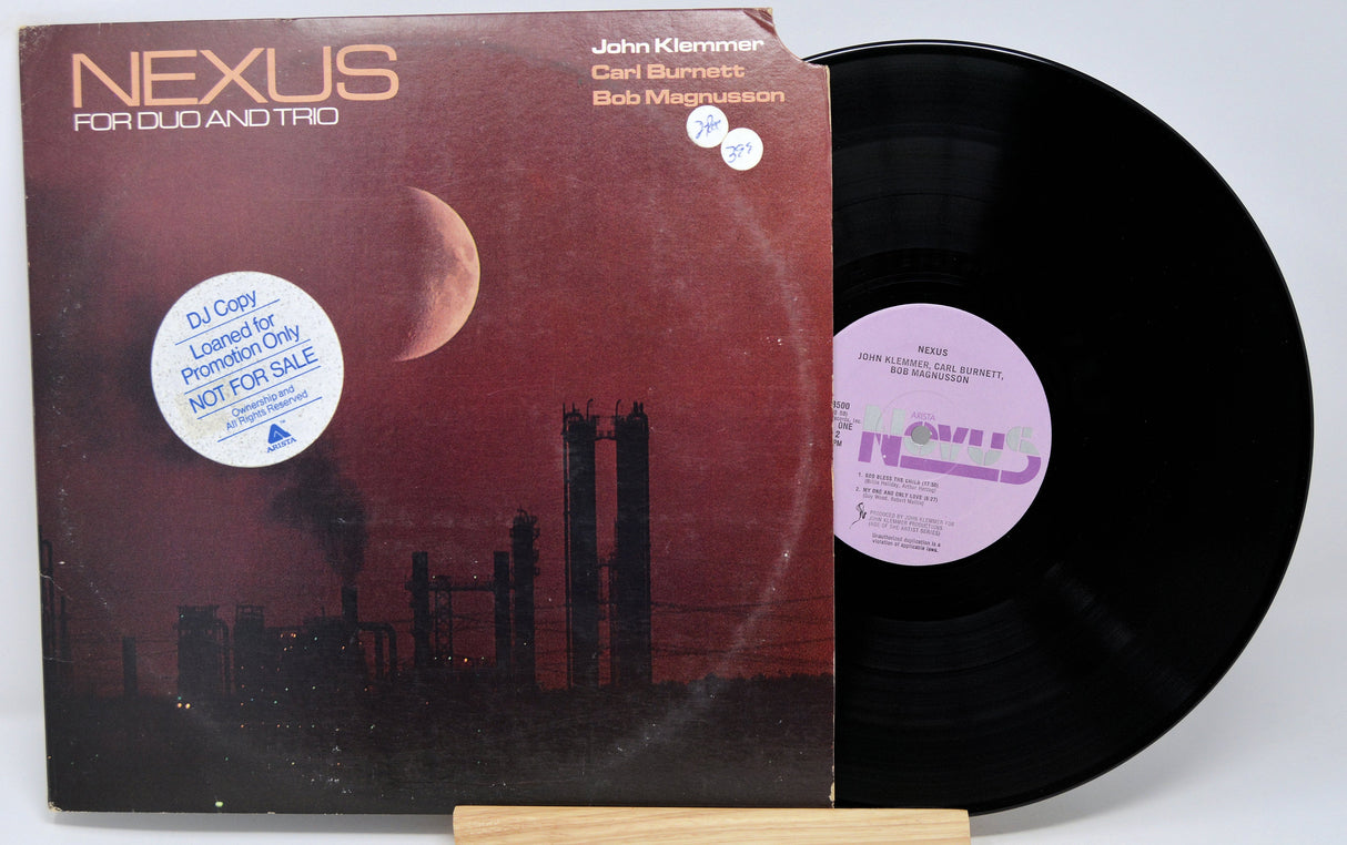 Front cover and vinyl record of Nexus For Duo and Trio by John Klemmer, with DJ copy promotion sticker