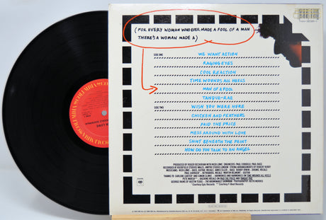 'Nick Lowe Abominable Snowman' Vinyl record with a detailed cover featuring text and graphics.