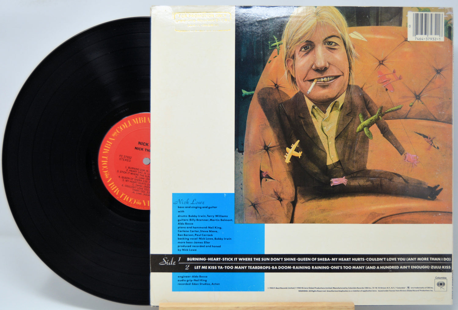 'Nick Lowe Nick The Knife' Vinyl record with its cover featuring a drawing of person smoking a cigarette.