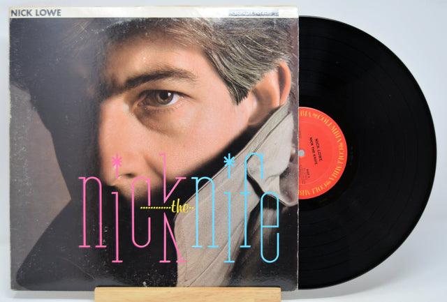 'Nick Lowe Nick The Knife' Vinyl record with a portrait on the cover and a red label