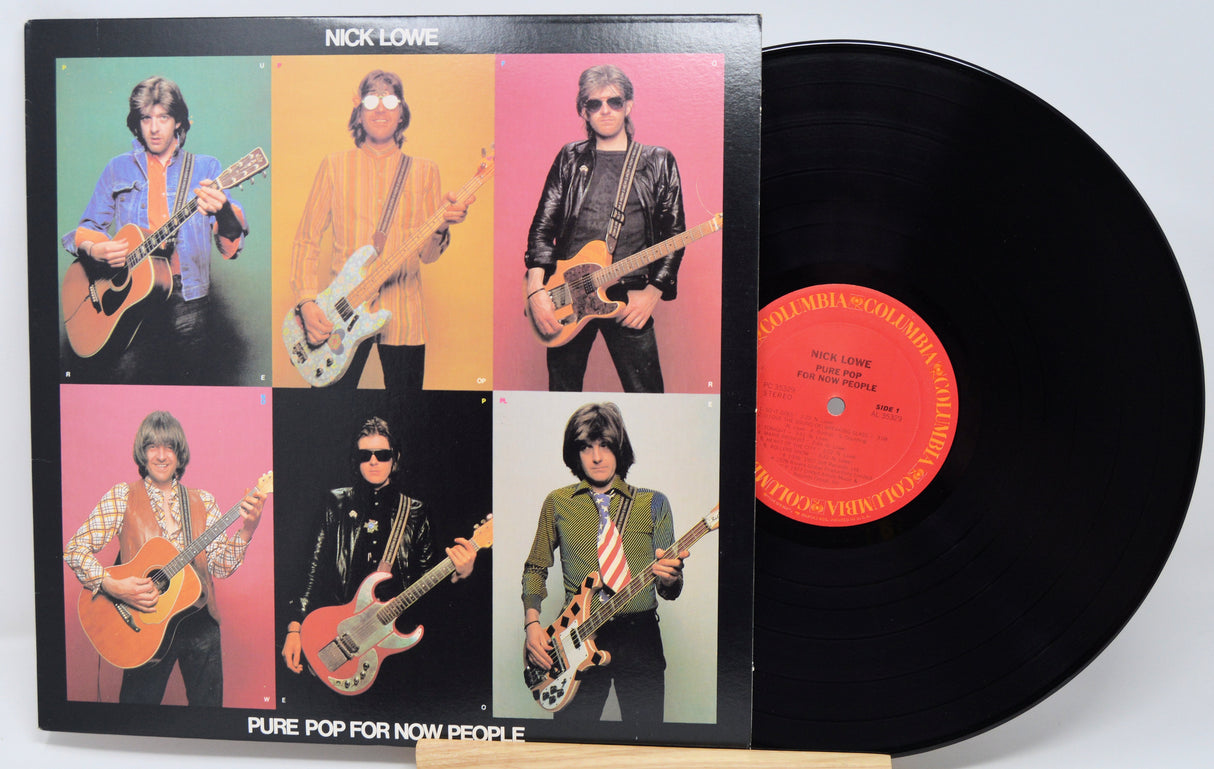 Vinyl record with cover featuring a musician playing guitar, on a white background