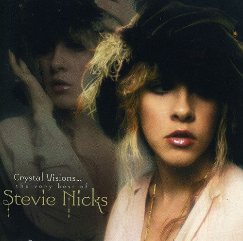Album cover for 'Crystal Visions... the very best of Stevie Nicks' featuring a woman with a hat.