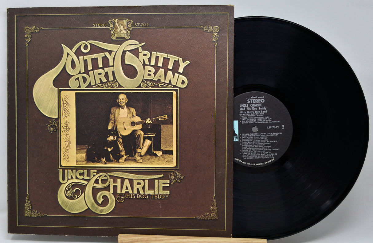 Vinyl record and cover of 'Uncle Charlie' by Ditty Gritty Dirt Band on a white background