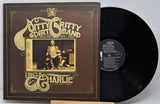 Vinyl record and cover of 'Uncle Charlie' by Ditty Gritty Dirt Band on a white background