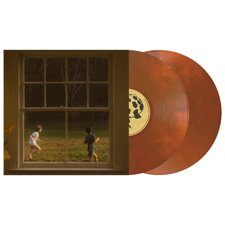 Vinyl records with a window view of two children playing outside.