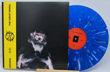 Vinyl record with blue disc and black cover featuring a person, with 'The Great Dismal' branding.
