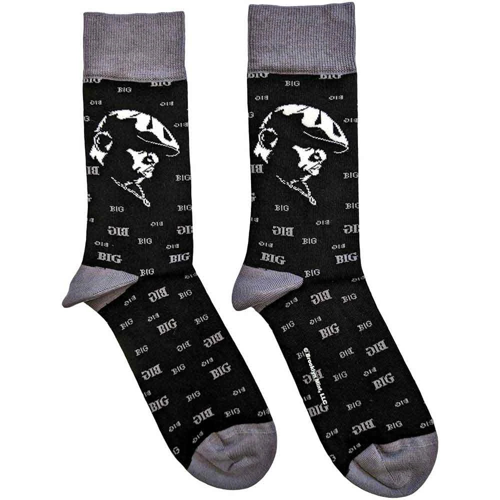 Black socks with white graphic design showing a side portrait of Biggie Smalls and gray toes and cuffs on a white background