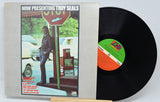 Front cover and vinyl record of 'Now Presenting Troy Seals' LP with Troy Seals by a stop sign