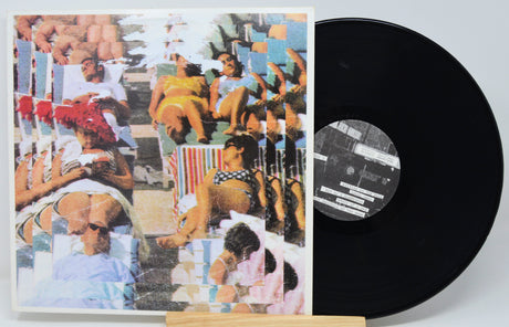 Vinyl record with a colorful cover featuring people on lounge chairs.