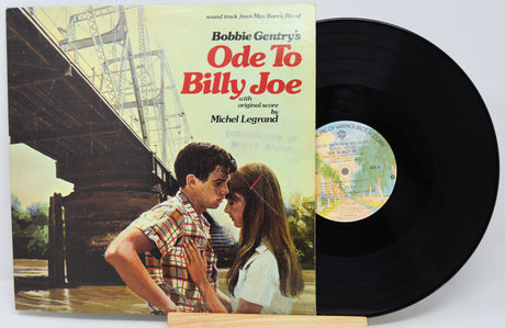 Vinyl record with cover featuring a couple and text 'Bobbie Gentry's Ode To Billy Joe' on a white background