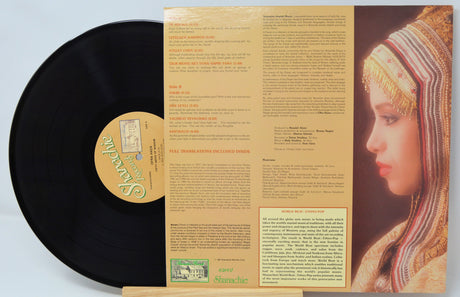 Vinyl record with a detailed inner sleeve featuring text and an image of a woman.