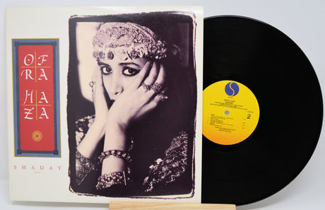 Vinyl record with a cover featuring a woman's portrait and album details.