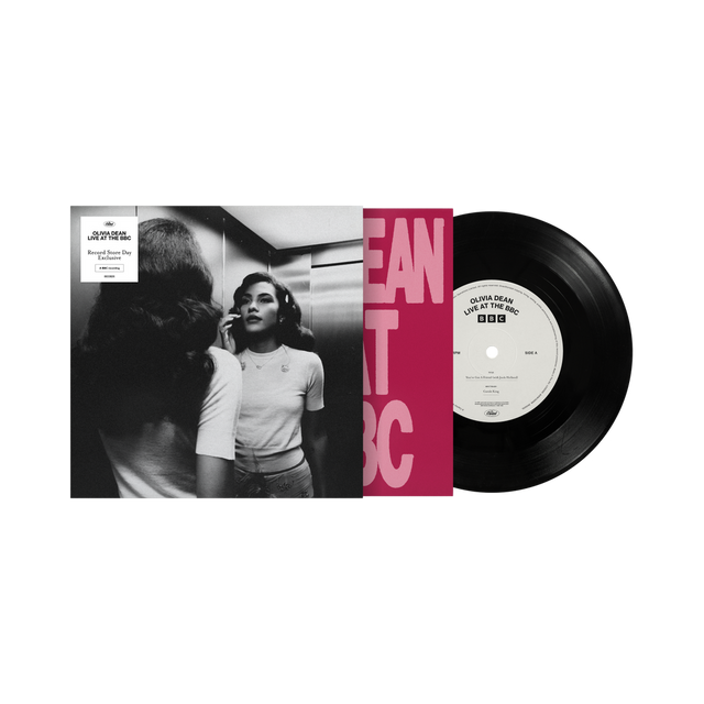 Vinyl record with a black and white photo and red text on the cover