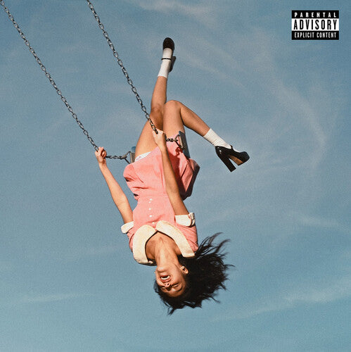 Person in a pink dress swinging upside down against a blue sky with a Parental Advisory label.