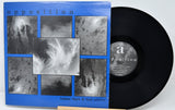 Vinyl record with a blue cover featuring black and white images and a visible label.