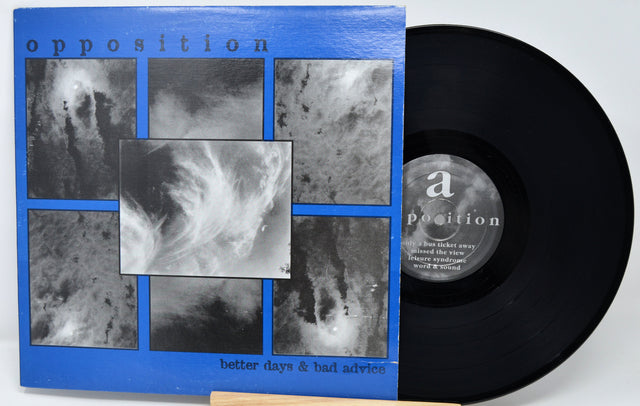 Vinyl record with a blue cover featuring black and white images and a visible label.