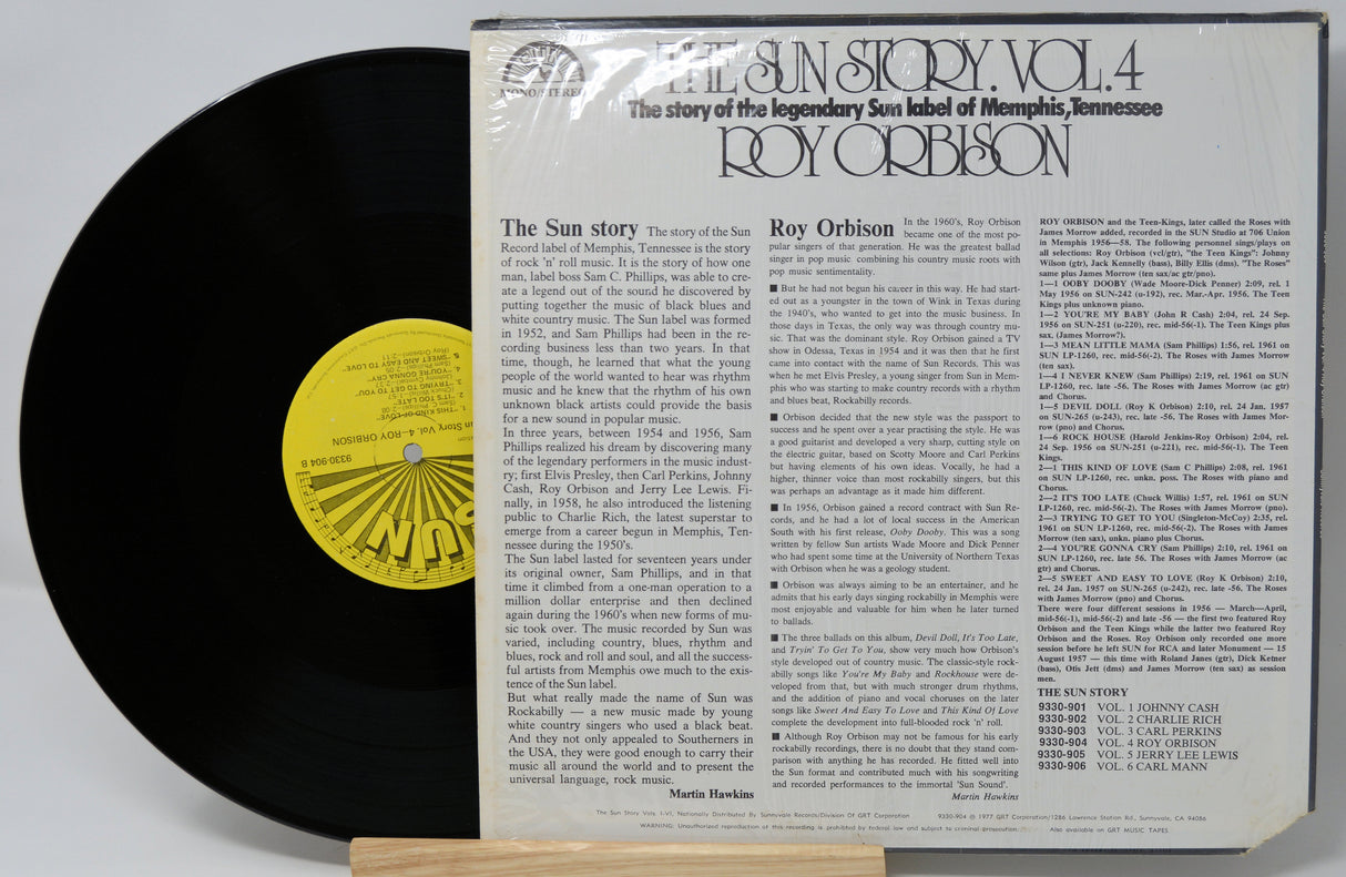 Vinyl record with a yellow label and its cover displaying text about Roy Orbison.