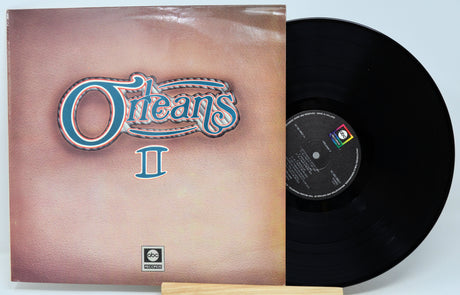 Vinyl record album 'Oceans II' with the illustrated cover on the left and the black record partially pulled out on the right, photographed against a light gray background.