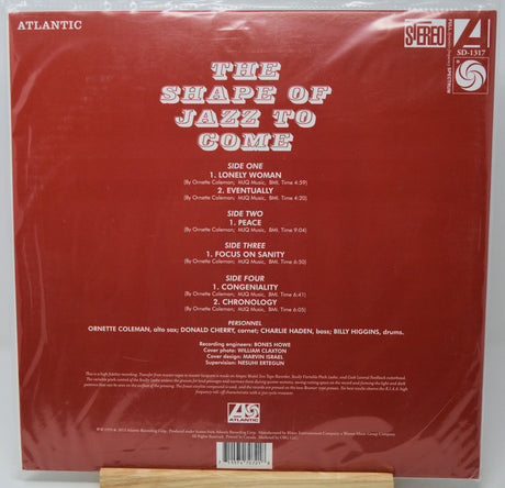 The back cover of a vinyl record for 'The Shape of Jazz to Come' by Ornette Coleman, featuring a dark red background with white text and Atlantic Records branding.