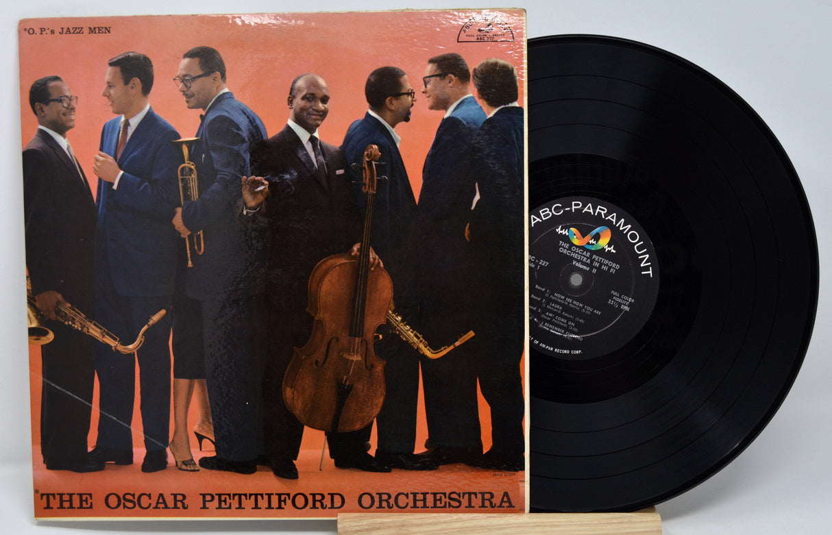 Front cover of Oscar Pettiford Orchestra in Hi-Fi Vol. 2 LP featuring group portrait of the jazz orchestra and vinyl record