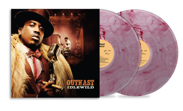 Outkast - Idlewild vinyl record album with the illustrated cover on the left and two translucent marbled pink-purple records on the right, shown on a white background.