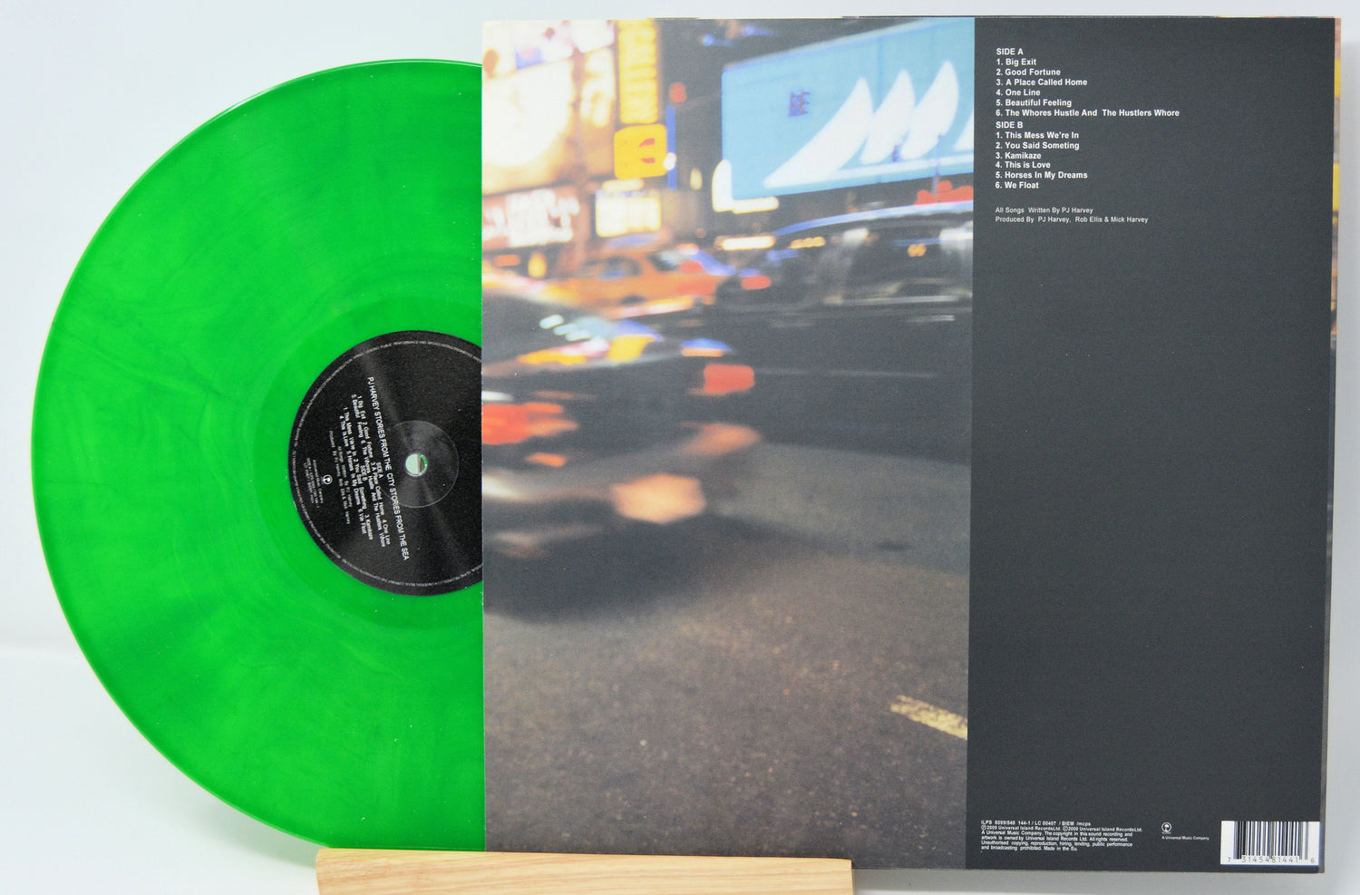 Back cover and tracklist of PJ Harvey's Stories From the City, Stories From the Sea album with translucent green vinyl