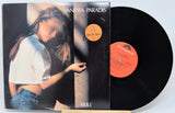 Vinyl record with cover featuring a person, brand 'Dolby' visible
