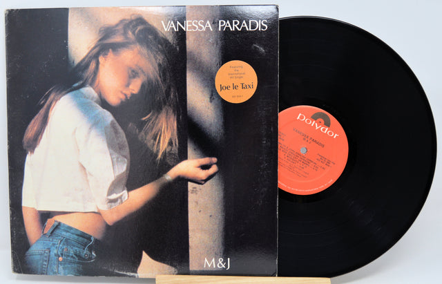Vinyl record with cover featuring a person, brand 'Dolby' visible
