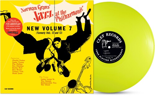 Yellow vinyl LP record with a black and red label, featuring text and an illustration of a bird. The packaging includes a booklet with additional information.