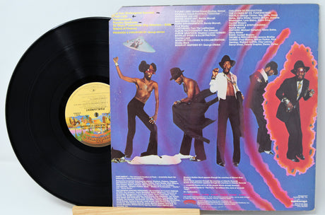 Back cover of Parliament Funkentelechy Vs. The Placebo Syndrome vinyl LP featuring band members in funky outfits